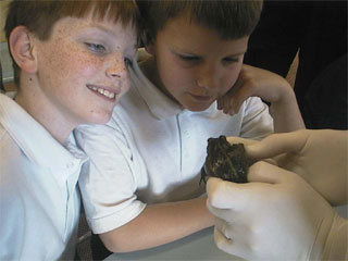 Students Justin Matthies and Lachlan Kirkbright happily examine their subject